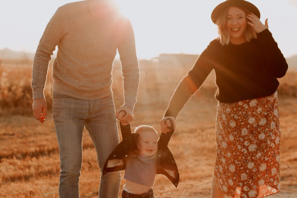 photo-of-couple-holding-their-baby-3767509